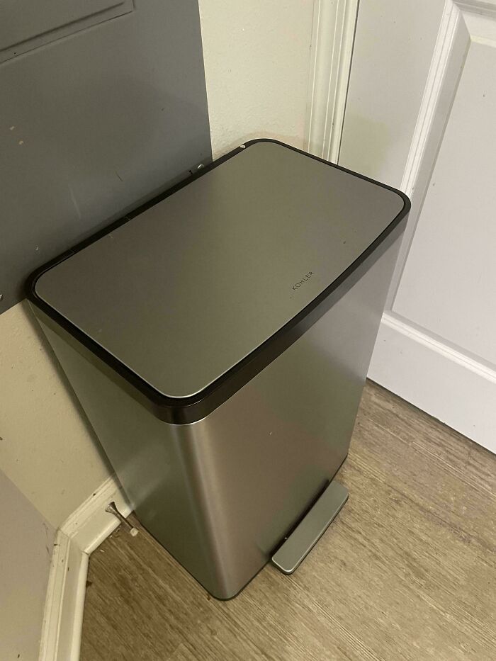 Modern metal trash can found while dumpster diving, showcasing a sleek design and high value.