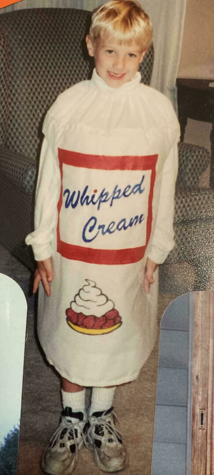 Child in a whipped cream costume, embodying a nostalgic blunder from their younger years.