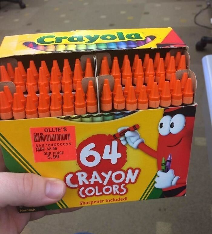 Box of Crayola crayons labeled 64 colors containing only orange crayons, a bizarre reality twist captured in a photo.