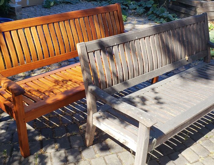"Power washing comparison of two benches, showing a clean restored bench and a weathered one in a garden setting."