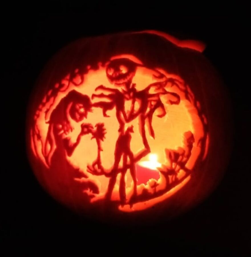 Pumpkin carving of spooky characters illuminated from inside, showcasing quirky and charming pumpkin carvings art for Halloween.