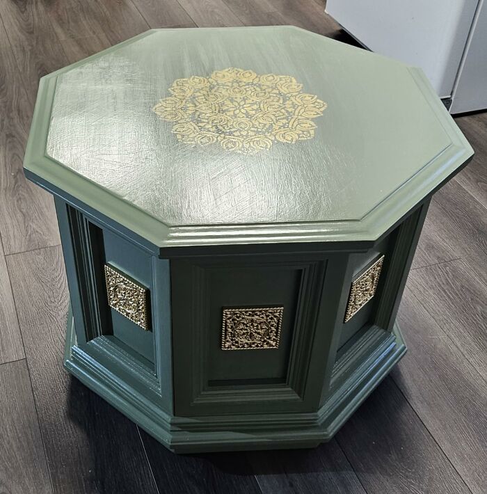 Green octagonal DIY home project table with decorative gold accents on wood flooring.