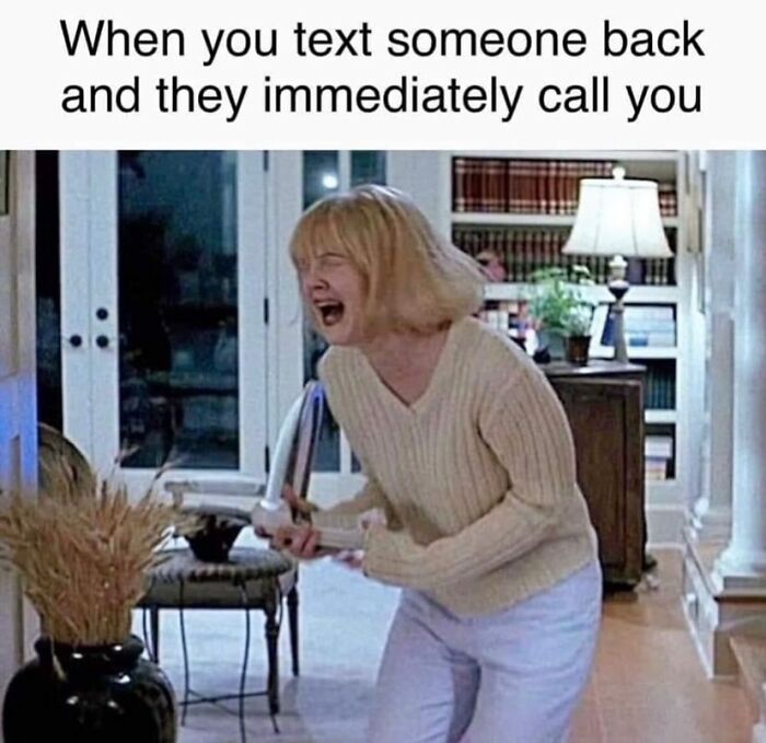 Woman in beige sweater holding a phone, reacting dramatically to texting and immediate calling, relatable introvert meme moment.