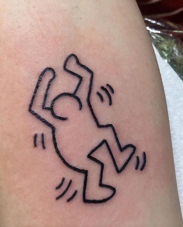 Simple line art tattoo depicting a dancing figure with motion lines. Tattoo ideas for men looking for minimalist and playful designs.