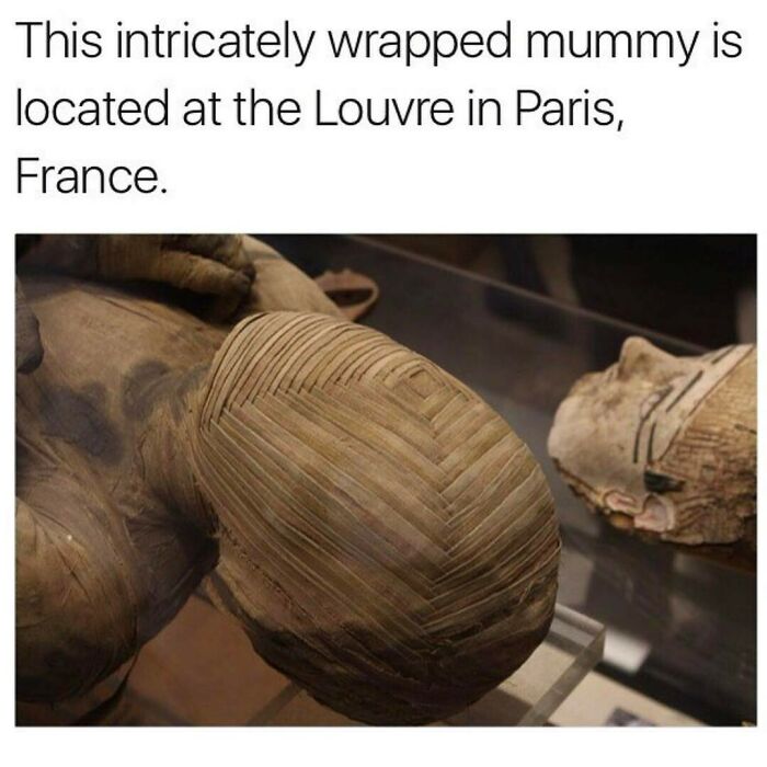 Intricately wrapped mummy with layered bandages displayed at the Louvre, evoking creepy and eerie ancient vibes.