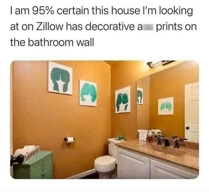 Bathroom with cringeworthy design featuring questionable art prints on the wall.
