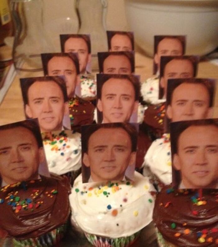 Cupcakes with multiple identical celebrity face toppers, showcasing a bizarre and hilarious reality twist in a party setting.