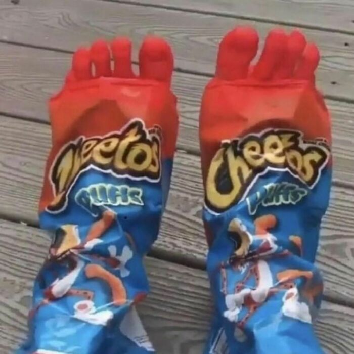 Feet appearing as Cheetos puffs snack bags in a bizarre and dark hilarious twist of reality captured in a photo.