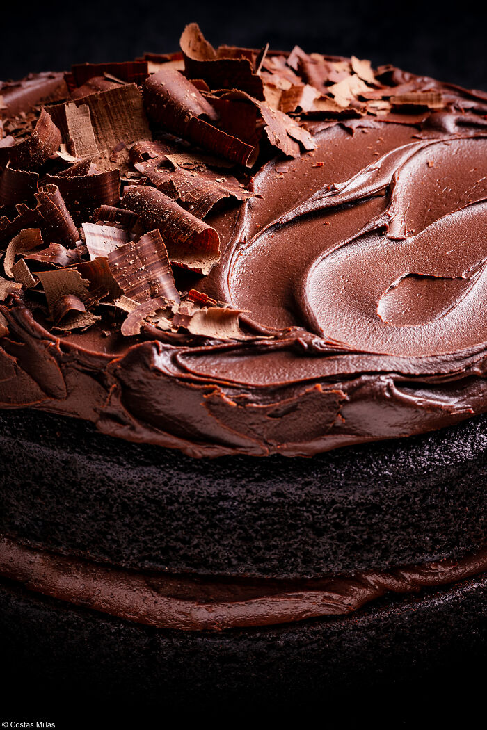 Decadent chocolate cake with rich frosting and chocolate shavings, celebrating National Cake Day Tiptree Cake Awards.