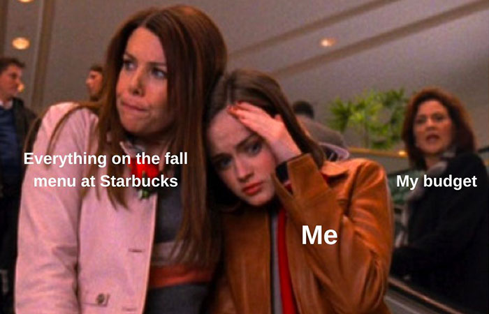 Stressed person labeled "Me" comforted by "Fall menu at Starbucks," with "My budget" in the background. Cozy season meme.