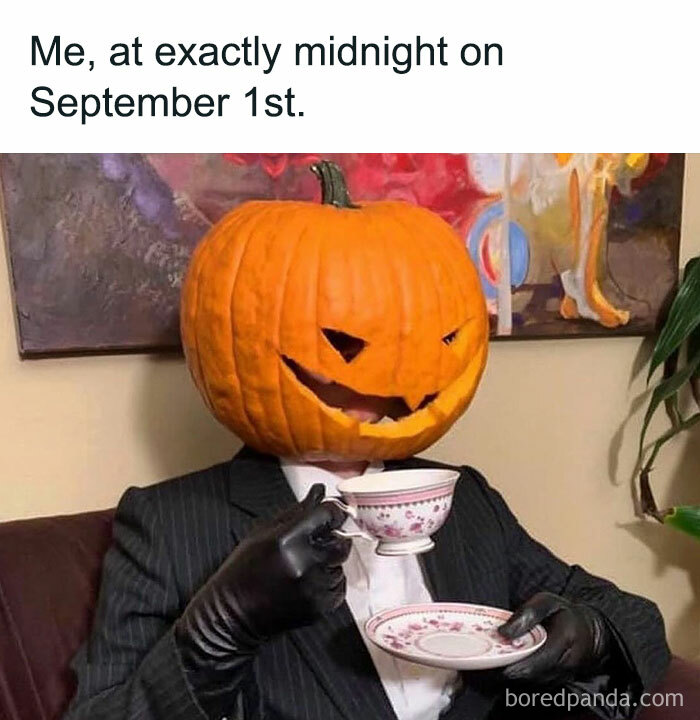 Halloween meme with a person in a suit wearing a pumpkin head, sipping tea humorously.