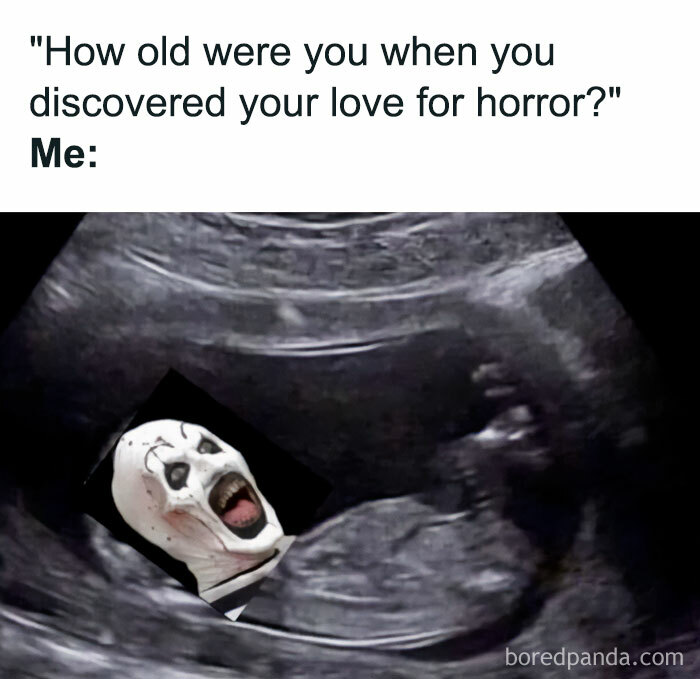 Halloween meme featuring a scary clown face in a sonogram, humorously depicting a love for horror from birth.
