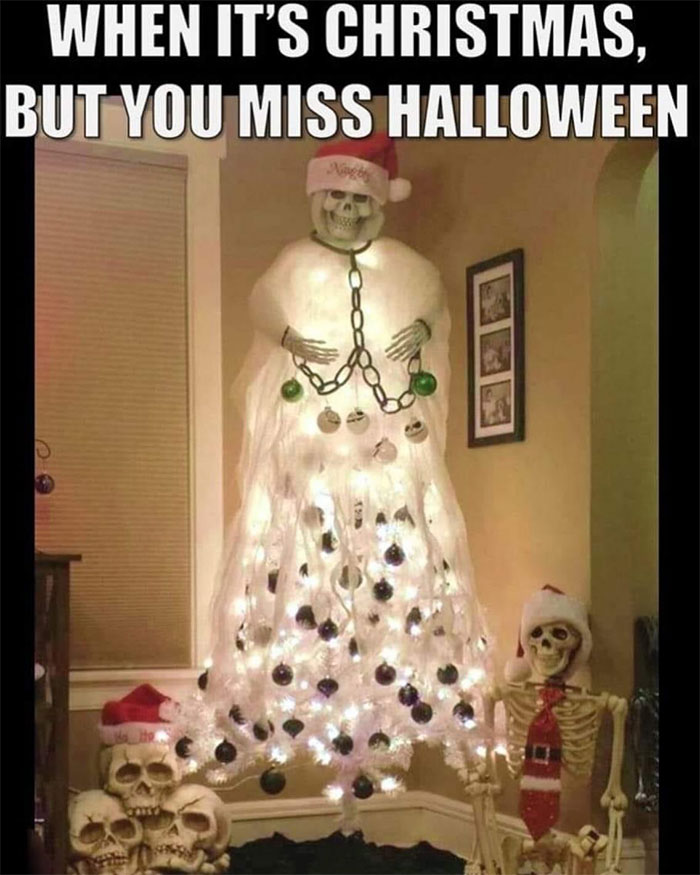 Skeleton-covered Christmas tree with Halloween decor, creating a freakishly hilarious meme.