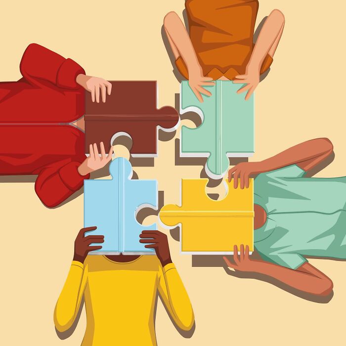 Illustration of diverse people holding puzzle pieces symbolizing unity and collaboration by Stephan Schmitz.