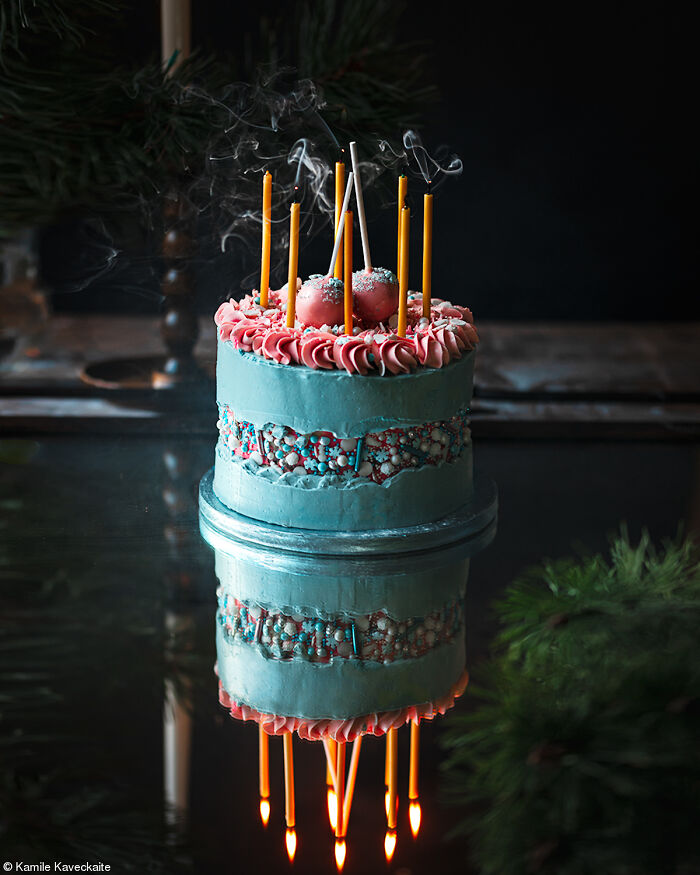 Blue and pink cake with candles, captured for Tiptree Cake Awards celebration by photographers worldwide.