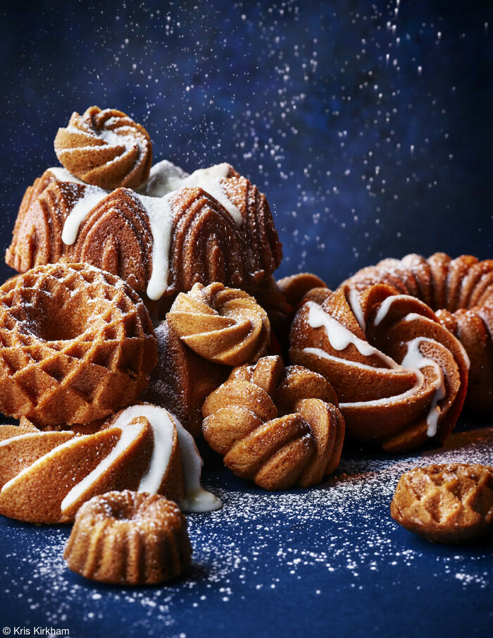 Assorted decorative bundt cakes dusted with sugar, celebrating National Cake Day and Tiptree Cake Awards.