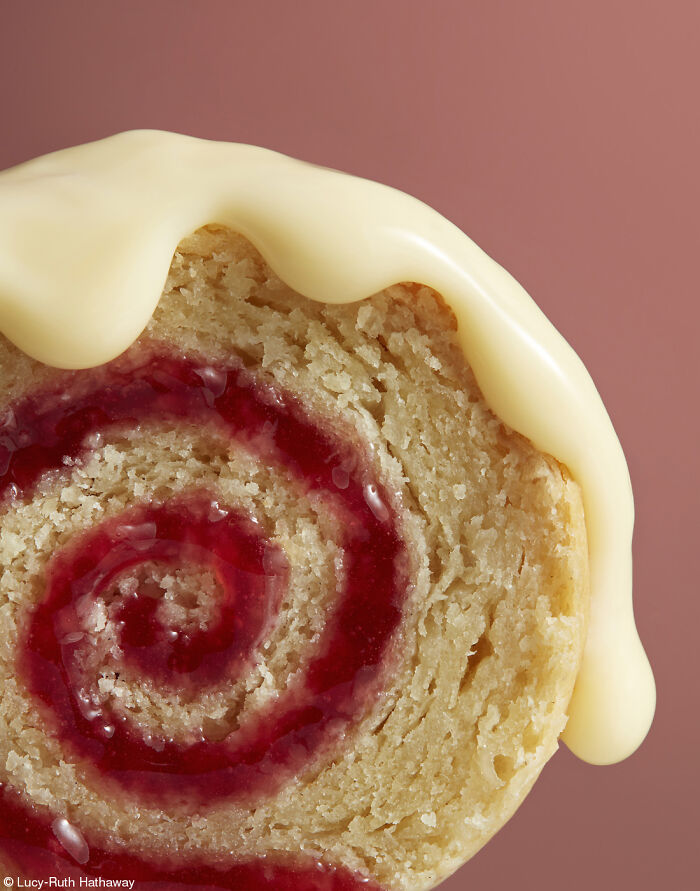 Close-up of a spiral cake with red jam and white icing for National Cake Day celebrations and Tiptree Cake Awards.
