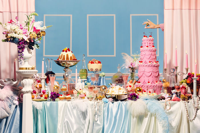 A lavish cake display with floral decorations, celebrating National Cake Day in a vibrant, elegant setting.