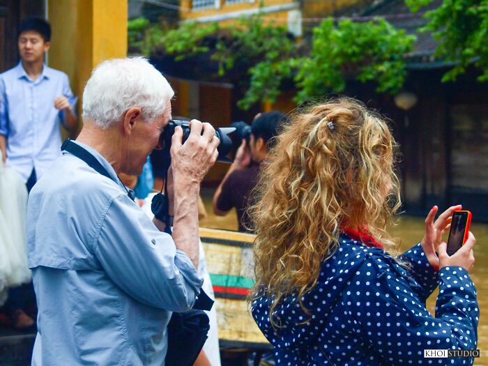 Tourists Use Cameras To Take Pictures Of Everyday Life