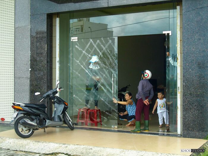 Residents Are Using Tape To Cover Glass Doors, In Case The Glass Breaks When The Storm Hits