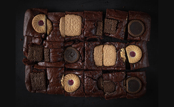Brownie cake with assorted biscuits, photographed to celebrate National Cake Day during Tiptree Cake Awards.