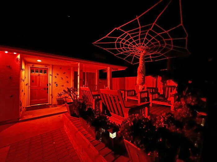 First Time Decorating For Halloween. Spiders, Web, And Body Are DIY. Added Red Cellophane Sheets To Porch Lights And Motion-Activated Spotlights