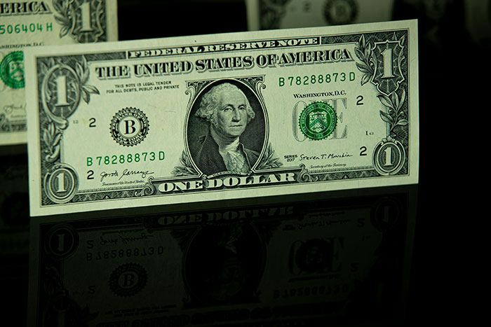 A single dollar bill representing minimal tipping by fiancée’s family at dinners. A single dollar bill representing minimal tipping by fiancée’s family at dinners.