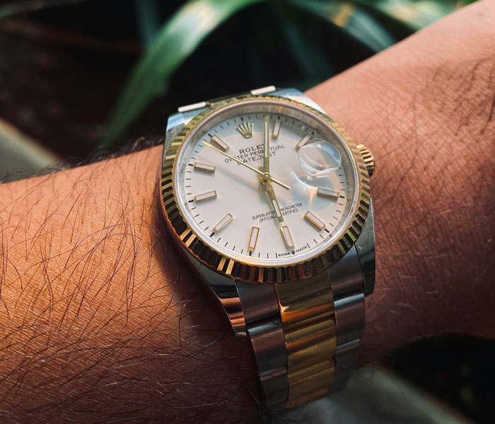 Close-up of a luxury watch on a wrist, highlighting the theme of entitled behavior over wedding gifts. Close-up of a luxury watch on a wrist, highlighting the theme of entitled behavior over wedding gifts.
