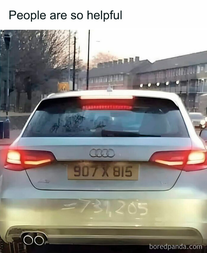 Car's dirty rear window showing a math equation as a joke, combining science and humor in a meme format on a city street.