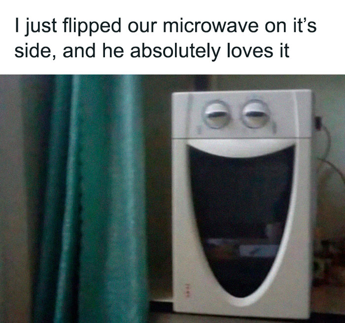 Microwave turned on its side, resembling a funny face with a wide grin, as an example of cringeworthy design fails.