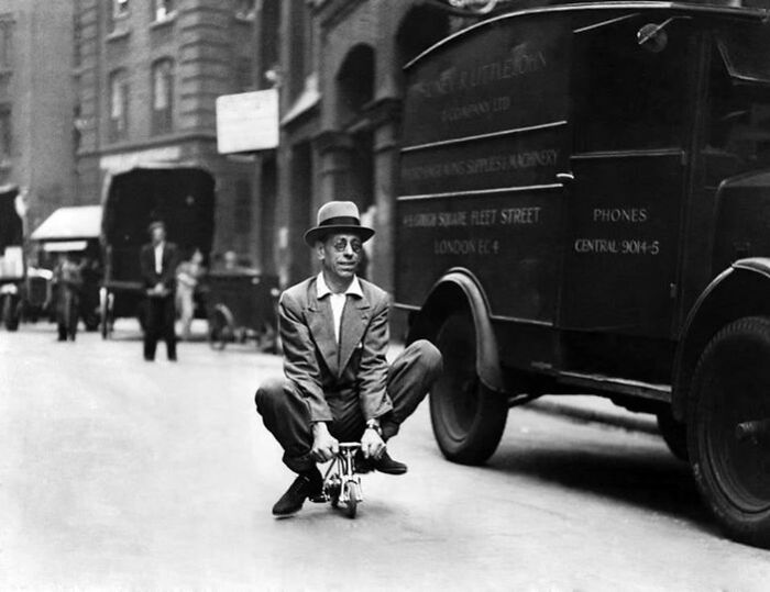 Cycle Engineer Riding The World’s Smallest Bicycle Through The City, London, August 1937