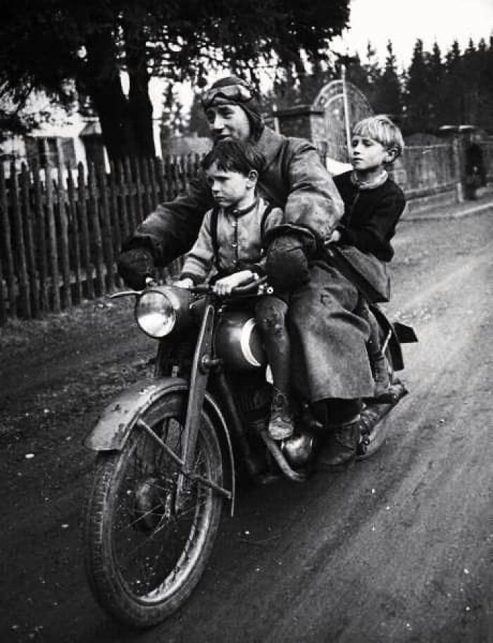 Munich, Germany, May 1949 Of A Man And His Two Boys Riding On Their Daily Commute