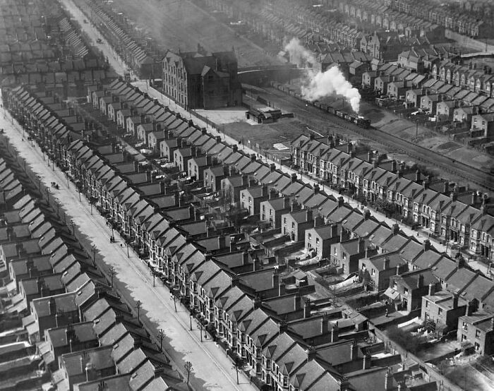 A Train Passes Through Densely Packed Housing Along Kensal Rise, London, England. March 1921
