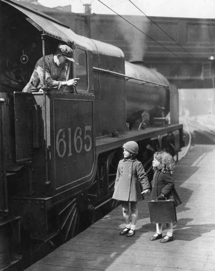 A Train Driver At Euston Station In London Talks To Two Young Girls On The Platform. April 1936