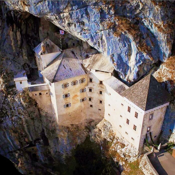 Predjama Castle, Located In Slovenia, Is A Striking Example Of Renaissance Architecture Uniquely Integrated Into A Towering 400-Foot Cliff