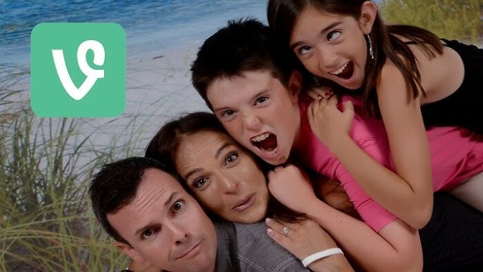 Four people playfully stacked outdoors near beach grass with the Vine app logo, representing trends that disappeared quickly online.