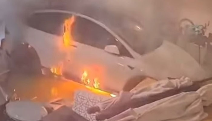 A Car Catches Fire After A Garage Floods