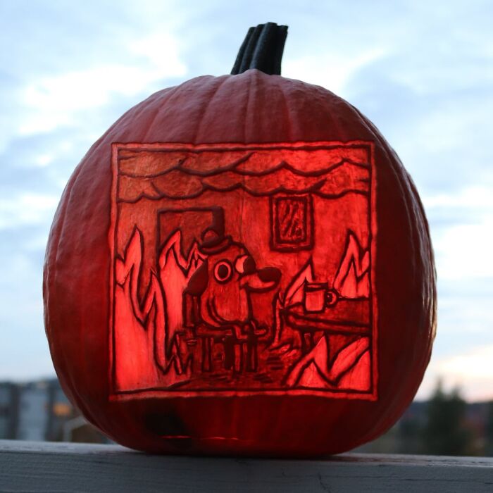 Pumpkin carving glowing at dusk featuring a quirky dog in a burning room scene, showcasing spooky and charming pumpkin carvings.
