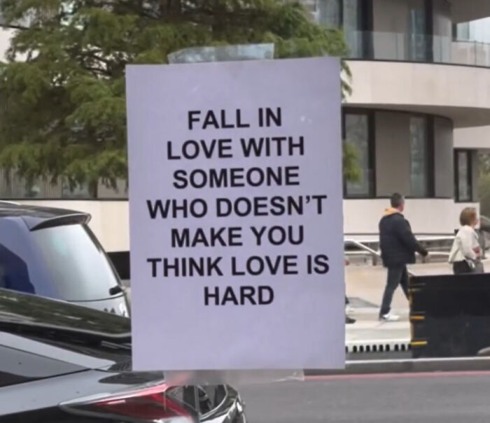 Wholesome street message in London encouraging people to fall in love with someone who makes love feel easy and genuine.