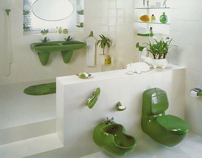 Vintage bathroom interior with green fixtures and plants, showcasing captivating mid-century design from the 50s to 80s.