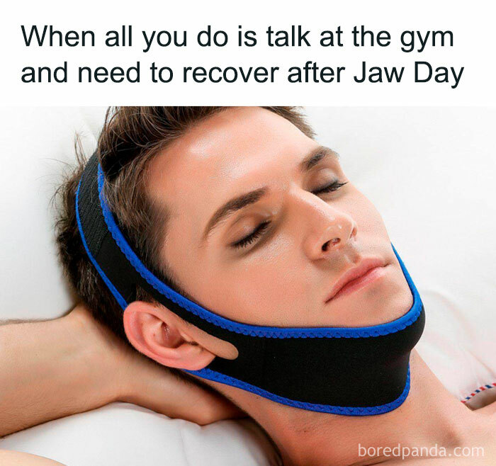 Close-up of a man resting with a chin strap after a humorous gym session, captioned about recovering from "Jaw Day."