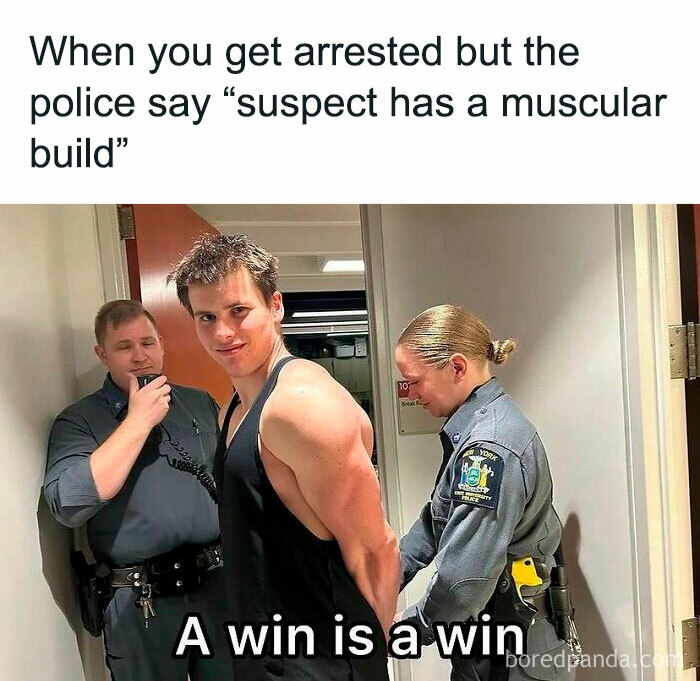 Man smiling while handcuffed by police officers, captioned "A win is a win," showcasing gym meme humor.