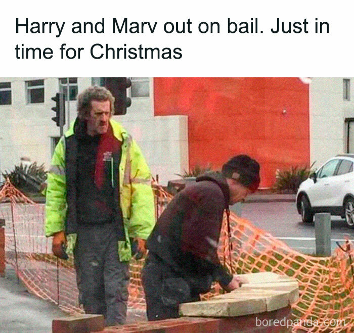 Two men in construction attire, one sawing wood, humorously captioned about Christmas in Ireland.