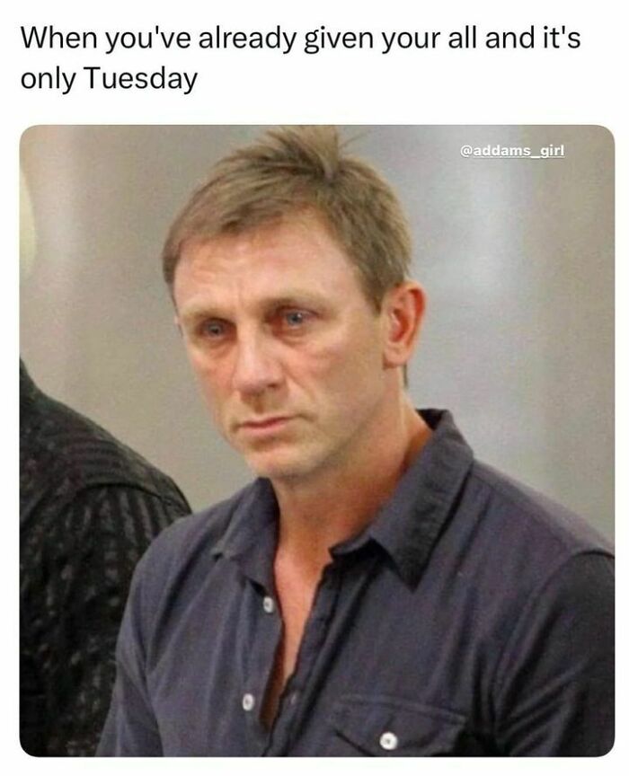 Tired man in casual shirt looks exhausted, capturing relatable mood for those done interacting with others.