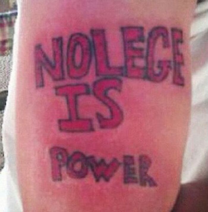 Misspelled tattoo reading "NOLEGE IS POWER" in bold letters, featuring a permanent mistake.