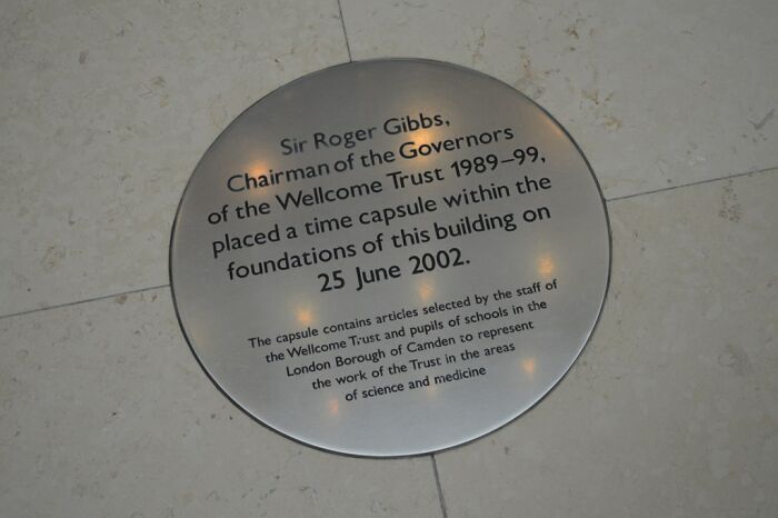 Plaque marking a historical time capsule placed by Sir Roger Gibbs in 2002 at the Wellcome Trust.
