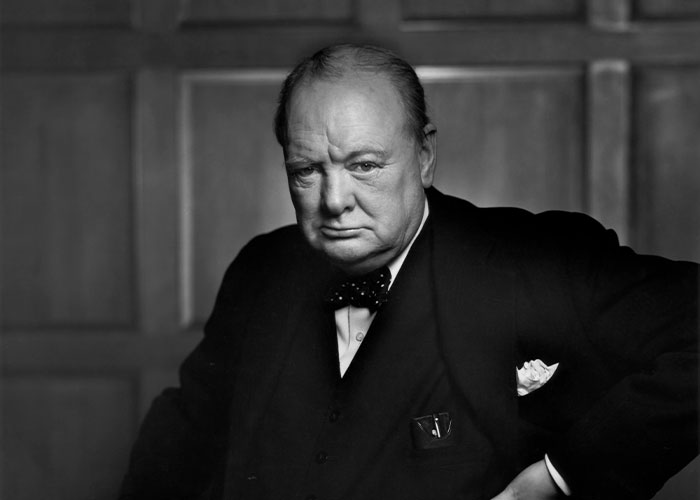 A man in a suit with a serious expression, representing concepts of savage insults.