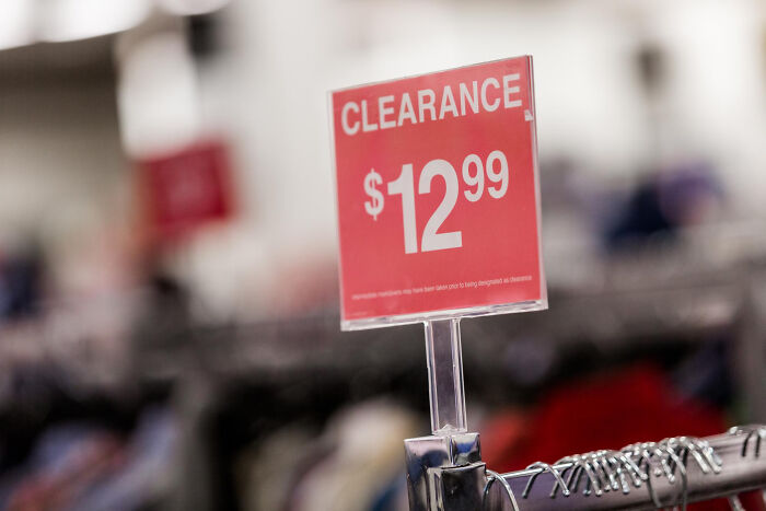 Clearance sale sign displaying $12.99, illustrating reverse culture shock for Americans who lived abroad.