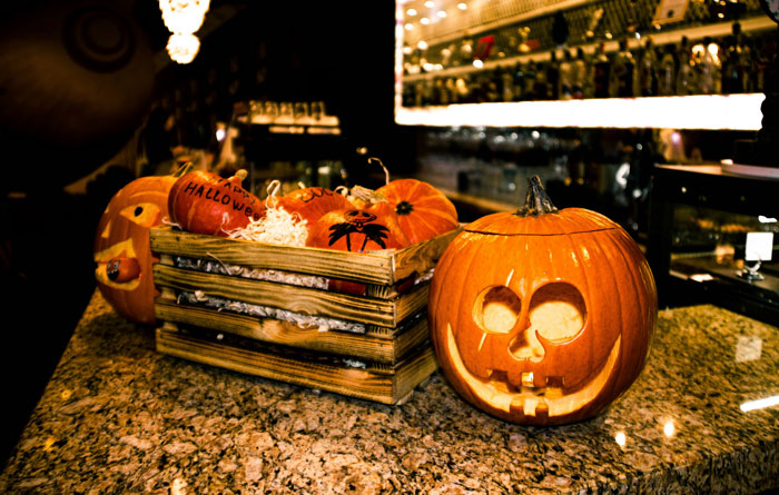 Halloween pumpkins on a kitchen counter, supporting son's interest with family drama theme.