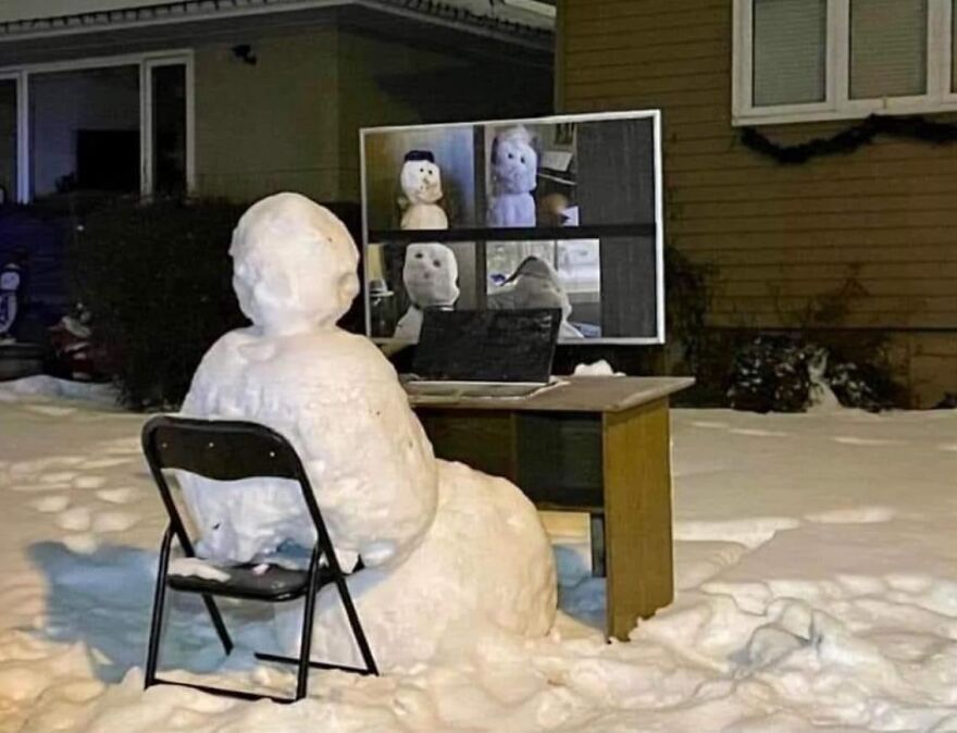 Snowman in a virtual Zoom meeting on a snowy night, showcasing pics that go hard.
